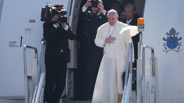 Pope Francis waves from the steps of his aircraft as he leaves Villamor Airbase for Rome on January 19, 2015 in Manila, Philippines.