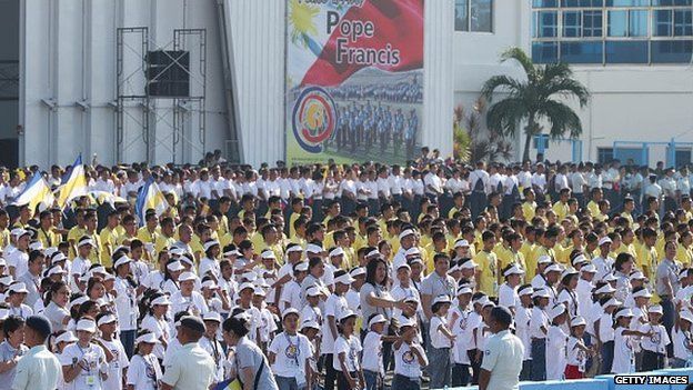 School children perform as Pope Francis leaves Villamor Airbase for Rome on January 19, 2015 in Manila, Philippines.