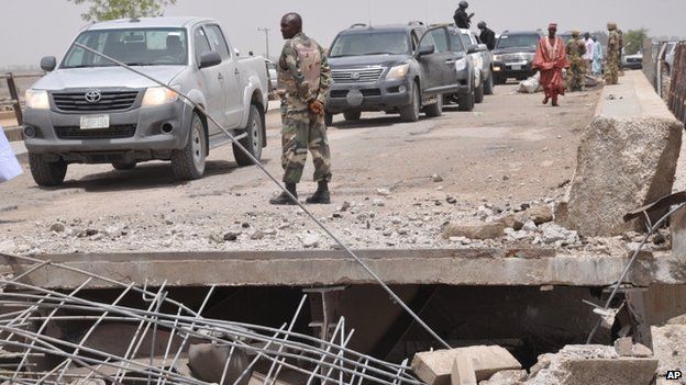 Officials inspects a bridge that link Nigeria and Cameroon following a suspected Boko Haram attack. Photo: May 2014