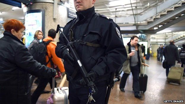 A French police officer patrols at the SNCF railway station La Part-Dieu in Lyon on 16 January 2015