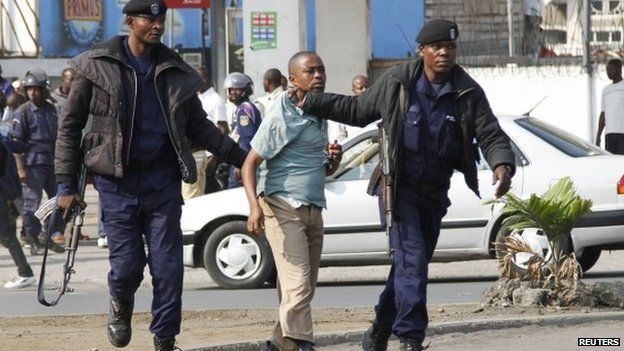 Police detain a protester in Goma, DR Congo, on 19 January 2015
