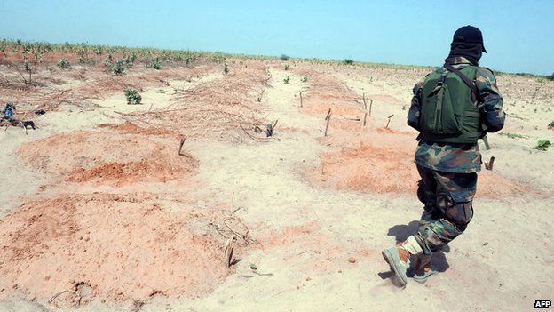 A soldier walks alone in Baga, Nigeria