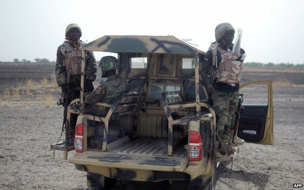 Nigerian soldiers patrol in the north of Borno state on June 5, 2013 near Marte
