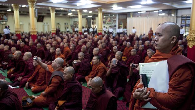Controversial Myanmar monk Wirathu (R) attends a meeting of Buddhist monks at a monastery outside Yangon on June 27, 2013. Buddhist monks met in Yangon to discuss a controversial proposal for a nationality law to restrict marriages between Buddhist women and men of other faiths which comes after outbreaks of deadly religious unrest.