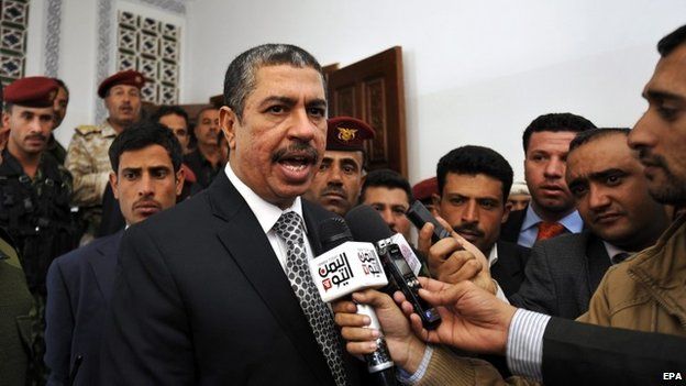 Yemen’s newly-appointed Prime Minister Khaled Bahah (C) speaks to reporters after the Yemeni parliament voted to support the new government, in Sana’a, Yemen, 18 December 2014