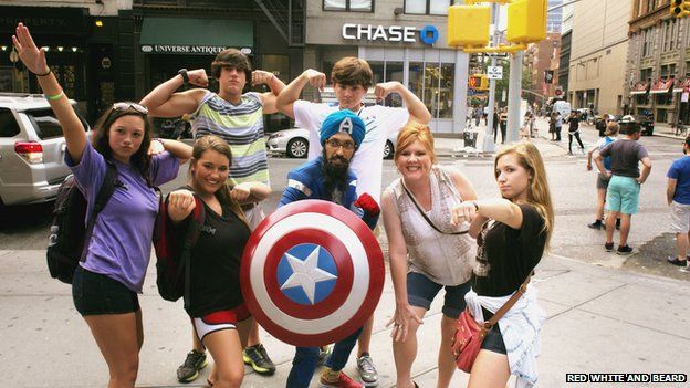 Singh takes a photo with a New York crowd