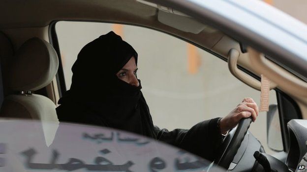 Aziza Yousef drives a car on a highway in Riyadh, Saudi Arabia, as part of a campaign to defy Saudi Arabia's ban on women driving on 29 March 2014