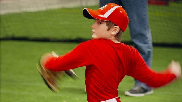 Child playing baseball