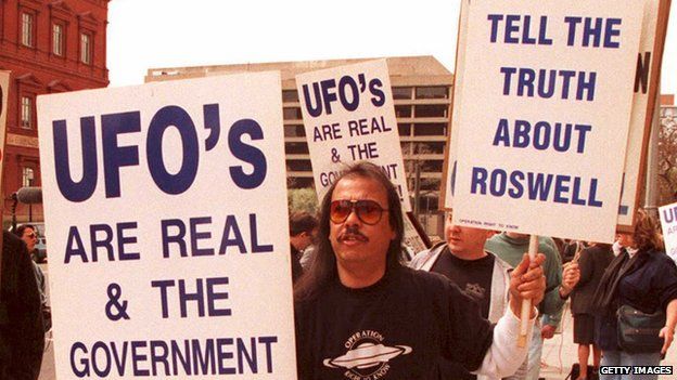 A UFO protestor stands outside the GAO building in Washington, DC, in 1995.