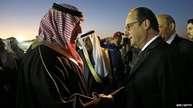 French President Francois Hollande (R) is welcomed by the Governor of the Riyadh Province, Turki bin Abdullah al-Saud (L) upon his arrival at Riyadh airport on 24 January 2015