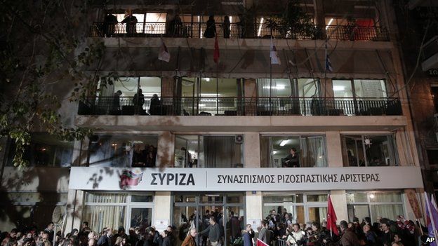Supporters gather outside the headquarters of the Syriza party in Athens