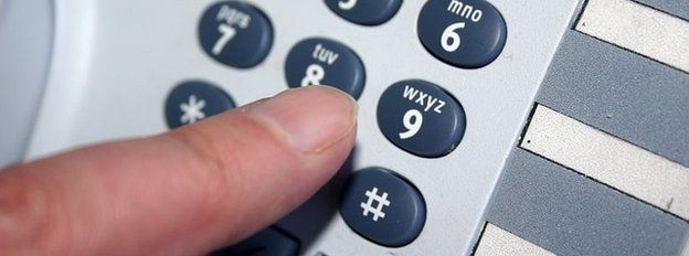 Generic pic of someone dialling a number