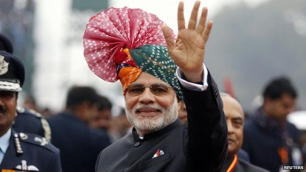 Prime Minister Narendra Modi waves to the crowd at the Republic Day parade in Delhi January 26, 2015