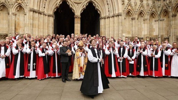 Bishop Libby Lane surrounded by other bishops