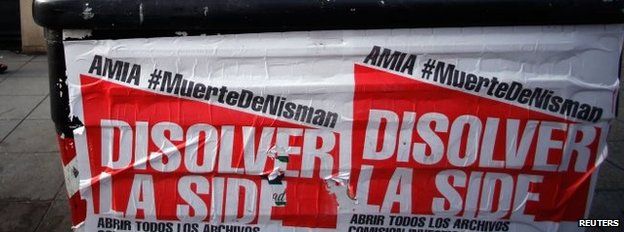 Posters on a rubbish container read "Dissolve the Side"
