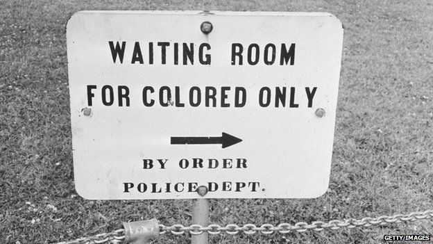Sign reading: "Waiting room for colored only by order of police dept."