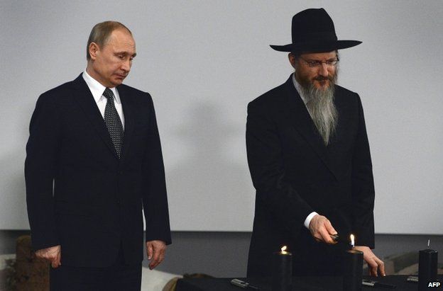 Russian President Vladimir Putin (left) attends ceremony in Moscow with Russia's Chief Rabbi, Berel Lazar, 27 January