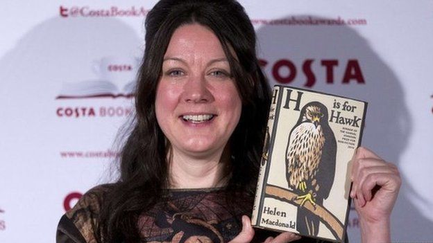 Helen Macdonald holding her book H is for Hawk
