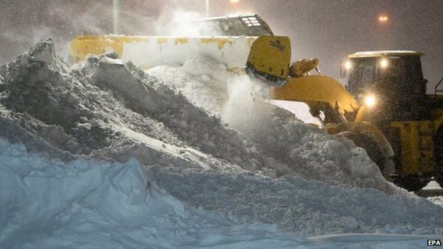 A snow plough clears snow in Burlington, Massachusetts, USA 27 January 2015. A snowstorm left up to 76cm (30in)of snow in the region.