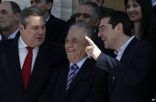 Prime Minister Alexis Tsipras, right, Deputy Prime Minister Giannis Dragasakis, centre, and Defence Minister Panos Kammenos in Athens, 28 January