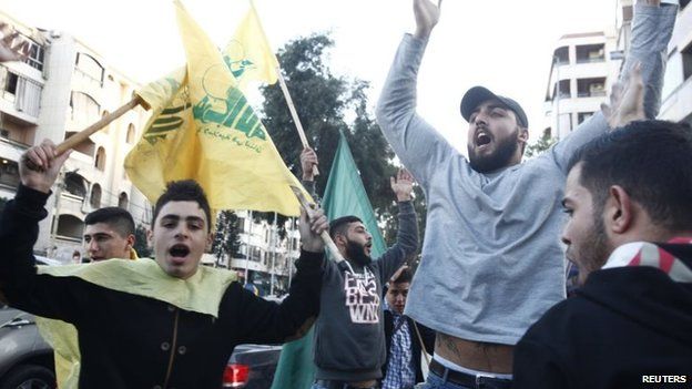 Hezbollah supporters in Beirut celebrate after hearing news of the attack on the Israeli military convoy (28 January 2015)