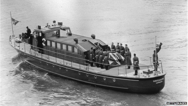 The Havengore carrying Sir Winston Churchill's coffin along the Thames