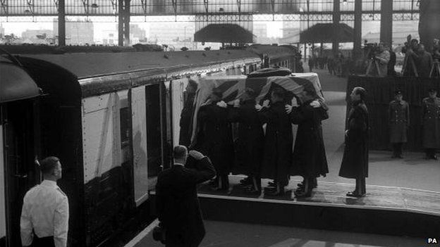 Churchill's coffin being loaded on to a train at Waterloo station