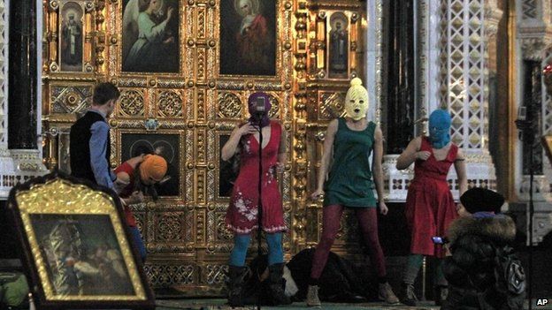 Members of the Russian radical feminist group Pussy Riot try to perform at the Christ the Saviour Cathedral in Moscow, 21 February 2012