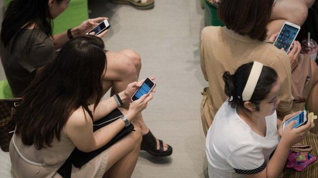 People using smartphones