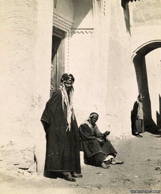Street scene in Kuwait, shows two men in a doorway, 1918