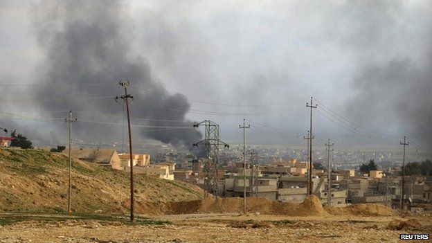 A general view shows the town of Sinjar as smoke rises from what activists said were U.S.-led air strikes December 22, 2014
