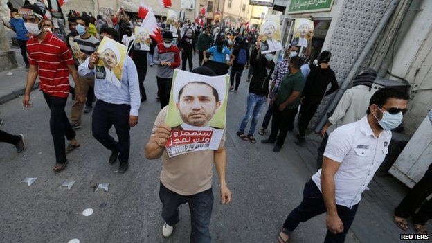 Protesters carry photos of Bahrain's top opposition leader Ali Salman as they march in the neighbourhood of his home during a protest in the village of Bilad al-Qadeem south of Manama (30 January 2015)
