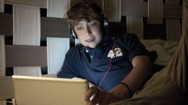 teen using a laptop
