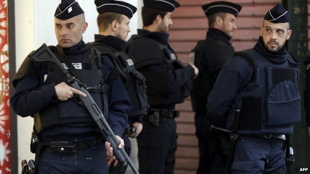 Security Police Forces stand guard outside the Jewish Community Centre in Nice where three soldiers, patrolling outside the centre were attacked by a man with a knife on 3 February 2015