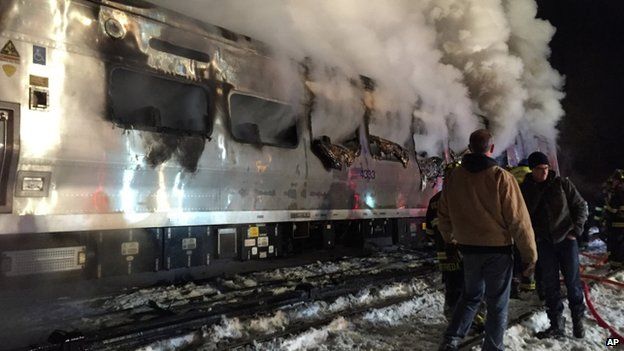 A Metro-North train smoulders after hitting a vehicle in Valhalla. Photo: 3 February 2015