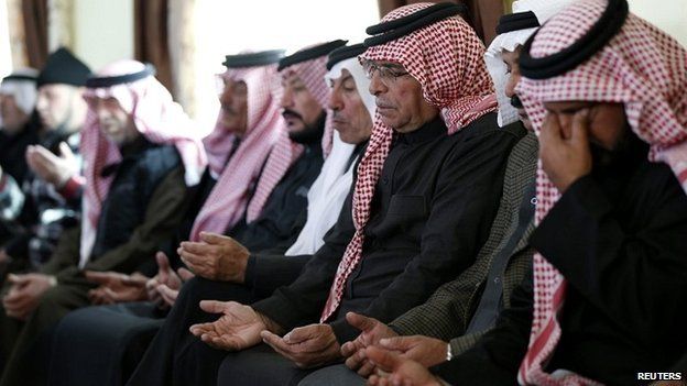 Saif al-Kasasbeh, the father of the Jordanian pilot, prays at the family's clan headquarters in the city of Karak - 4 February 2015