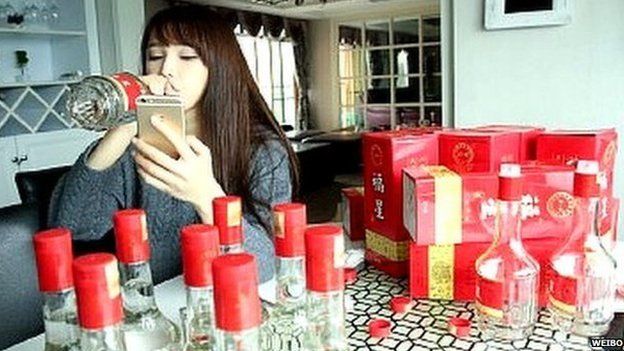Chinese woman drinking baijiu