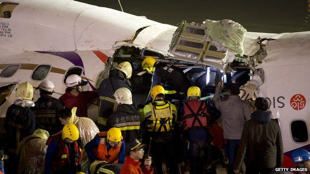 Rescuers finally gain entry to the previously submerged area of the plane