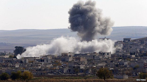 An explosion following an air strike is seen in western Kobani neighbourhood in November 2014