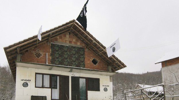A house in the Bosnian village of Gornja Maoca decorated with Islamic State flags, January 26, 2015