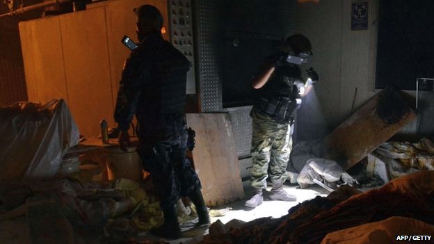 Mexican soldiers work at a private crematorium, where corpses were found in Acapulco, Guerrero State, on 6 February 2015