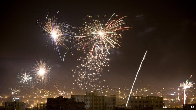 Houthi Shiite rebels and their supporters release fireworks after Shiite rebels announced that they have taken over the country and dissolved parliament in Sanaa,