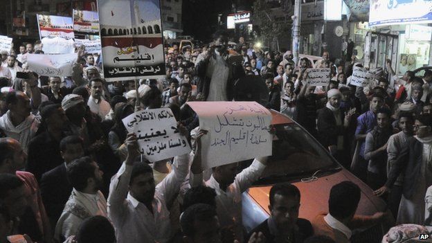 Yemeni people hold a rally to protest against Shiite rebels" announcement of taking over the country in Taiz, Yemen