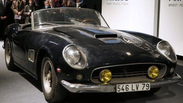 A Ferrari 250 GT California Spider (1961) is auctioned 14,2 million euros in Paris on February 6, 2015. An ultra-rare Ferrari that once belonged to actor Alain Delon and was discovered rusting under a pile of old magazines on a French farm fetched 14.2 million euros (16.2m USD) at auction today.