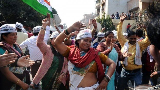 Indian Aam Aadmi Party (AAP) supporters celebrate the AAP"s victory in the state assembly elections outside the party"s headquarters in New Delhi on February 10, 2015.