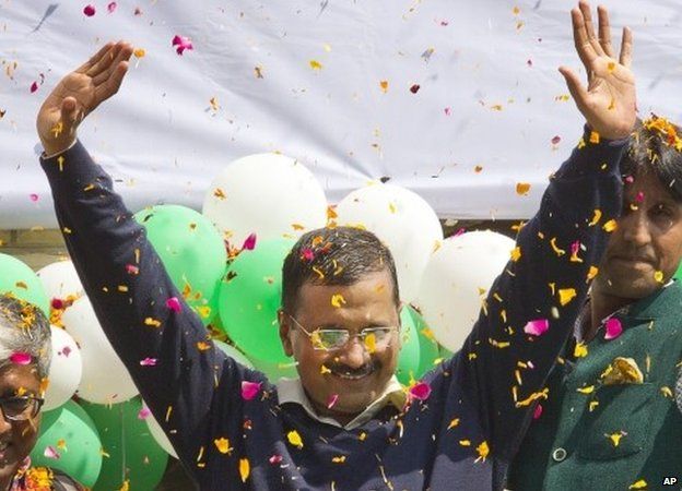 Leader of the Aam Aadmi Party, or Common Man's Party, Arvind Kejriwal waves to the crowd as his party looks set for a landslide party in New Delhi, India, Tuesday, Feb. 10, 2015