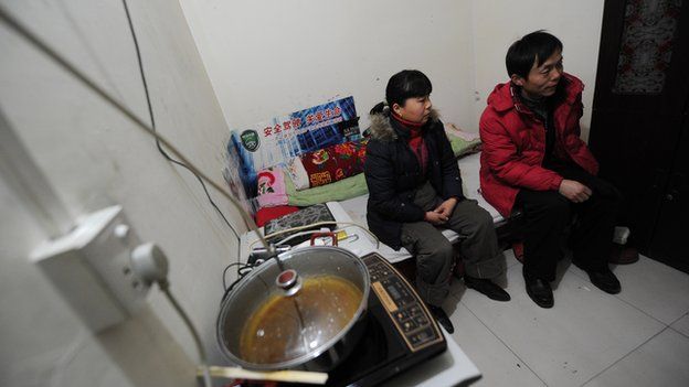 Two residents inside their underground apartment inside an old civil defence shelter