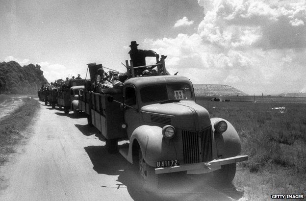 Vehicles loaded with people and their possessions leaving Sophiatown