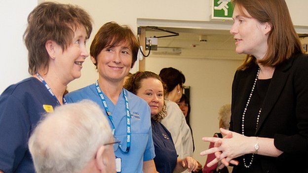 Kirsty Williams with hospital staff and patients