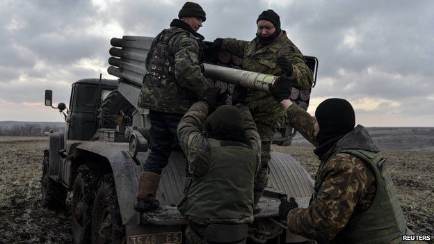 Ukrainian servicemen load Grad rockets near Debaltseve, 8 Feb 15
